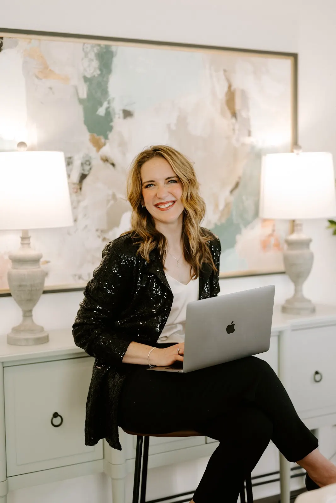 Rachel Ferrell working on a laptop in her home office