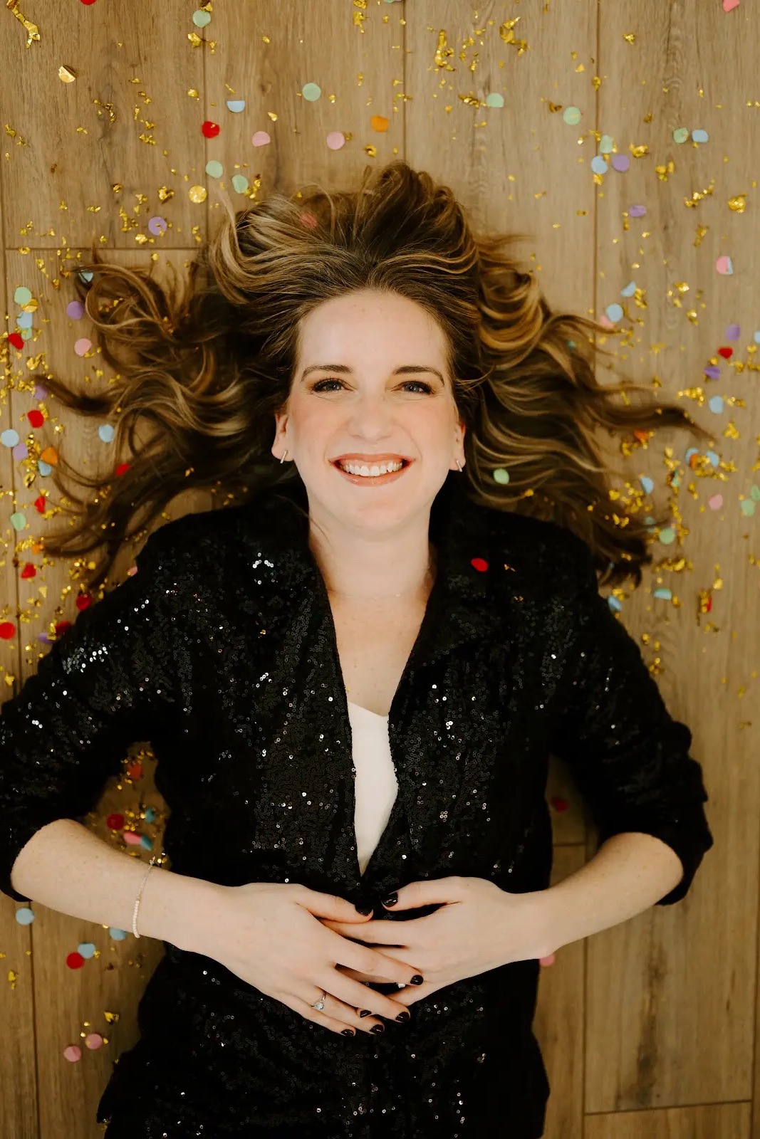 Rachel Ferrell in a playful editorial portrait with confetti